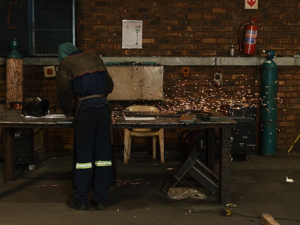 Grinding and finishing a fabricated part